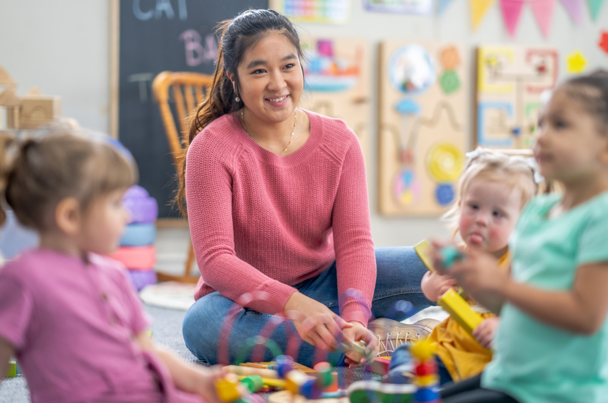 Australian teacher aide supervising a classroom.