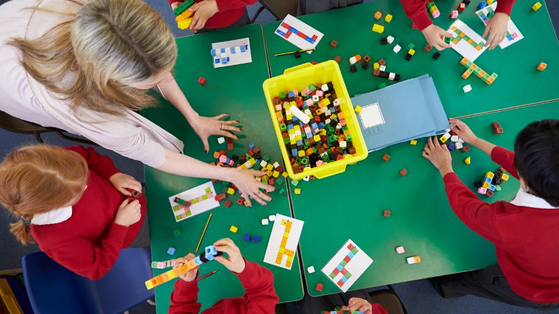 Classroom activity involving small blocks.