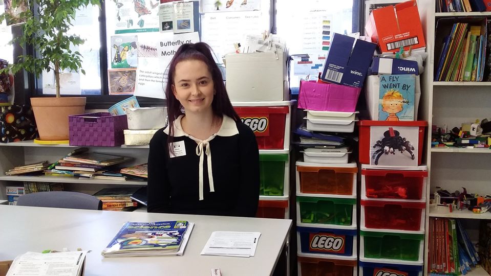 Teacher aide pictured doing a placement in a local school.
