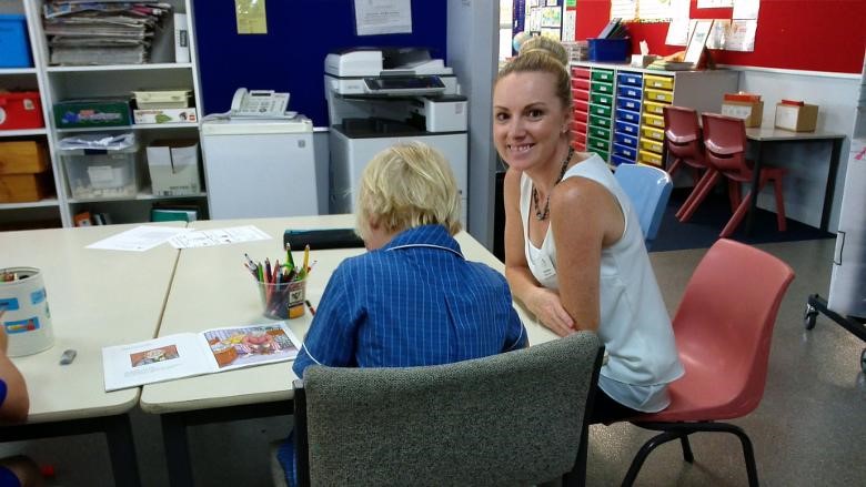 Picture of a teacher aide from ITAC doing her 100-hour placement in a school.