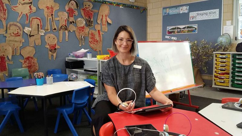 Teacher aide shown during her placement in a school.