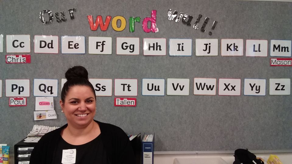 A teacher assistant from Sydney working in a school setting.